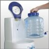 Woman refilling ET-Pure Reverse Osmosis Drinking Water System inside office
